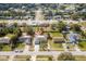 Aerial view of home in neighborhood with long driveway leading to the garage at 2665 Windsor Heights St, Deltona, FL 32738