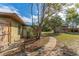 Side exterior view of house and backyard featuring a walkway at 2665 Windsor Heights St, Deltona, FL 32738