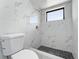 Bathroom featuring a modern shower with white marble tile and a black mosaic tile floor at 2665 Windsor Heights St, Deltona, FL 32738