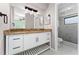 Bathroom featuring a modern vanity with a granite countertop and an updated shower at 2665 Windsor Heights St, Deltona, FL 32738