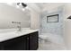 Bathroom featuring a modern vanity with a quartz countertop and an updated shower at 2665 Windsor Heights St, Deltona, FL 32738