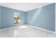 Bedroom featuring white tile flooring and a bright window at 2665 Windsor Heights St, Deltona, FL 32738