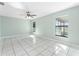 Large bedroom with tiled flooring and natural light, providing a relaxing space at 2665 Windsor Heights St, Deltona, FL 32738