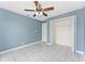 Bedroom featuring neutral walls, white tile flooring and a closet at 2665 Windsor Heights St, Deltona, FL 32738