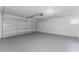 Spacious garage with epoxy floor and garage door at 2665 Windsor Heights St, Deltona, FL 32738