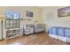 Bright Bedroom with wood-look flooring, lots of closet space, and natural light at 3050 Pirates Retreat Ct # 402, Kissimmee, FL 34747
