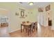 The dining room is bright and inviting with a wooden table and wicker chairs at 3050 Pirates Retreat Ct # 402, Kissimmee, FL 34747