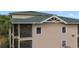 Exterior view of condo featuring screened balconies, offering residents a private outdoor space at 3050 Pirates Retreat Ct # 402, Kissimmee, FL 34747