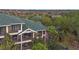 The screened balconies on multiple levels provide private outdoor spaces with lovely treetop scenery at 3050 Pirates Retreat Ct # 402, Kissimmee, FL 34747
