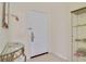 Clean foyer features a white entry door, glass table, and decorative display case at 3050 Pirates Retreat Ct # 402, Kissimmee, FL 34747