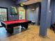 Community game room with professional-grade pool table and wall art at 3050 Pirates Retreat Ct # 402, Kissimmee, FL 34747