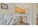 Open kitchen with wooden cabinets, a breakfast bar, and bar-stool seating near the living space at 3050 Pirates Retreat Ct # 402, Kissimmee, FL 34747