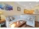 Living room with a large sectional sofa, coffee table, and bar-style seating at kitchen counter at 3050 Pirates Retreat Ct # 402, Kissimmee, FL 34747