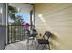 A cozy screened patio with outdoor seating offers a private space for relaxation at 3050 Pirates Retreat Ct # 402, Kissimmee, FL 34747