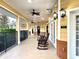 Extended porch area with rocking chairs and ceiling fans, ideal for enjoying a leisurely afternoon at 3050 Pirates Retreat Ct # 402, Kissimmee, FL 34747