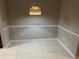 Dining room with tiled floors and modern hanging light fixture at 3561 Conroy Rd # 214, Orlando, FL 32839