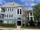 Attractive three-story condo building showcasing classic architectural details and professional landscaping at 3561 Conroy Rd # 214, Orlando, FL 32839