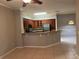 Spacious kitchen and living room area with tile floors at 3561 Conroy Rd # 214, Orlando, FL 32839