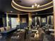 Elegant meeting room featuring dark walls, crown molding, and comfortable seating for professional gatherings at 3561 Conroy Rd # 214, Orlando, FL 32839