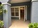 Private patio leading to an open kitchen with stone counters at 3561 Conroy Rd # 214, Orlando, FL 32839