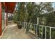 Covered balcony featuring white railings and an outdoor space ideal for relaxing and enjoying views of nature at 400 Ruth St, Longwood, FL 32779