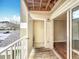 Exterior balcony with a storage closet and sliding glass doors leading to the interior, perfect for relaxation at 4280 Summer Landing Dr # 204, Lakeland, FL 33810