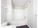 Clean bathroom featuring a shower-tub combination with white tile surround, complemented by modern fixtures and a neutral color scheme at 4280 Summer Landing Dr # 204, Lakeland, FL 33810