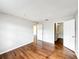 Bedroom with laminate wood floors and open closet and hallway at 4280 Summer Landing Dr # 204, Lakeland, FL 33810