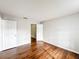 Bright bedroom featuring hardwood floors and an open closet, offering a spacious and inviting atmosphere at 4280 Summer Landing Dr # 204, Lakeland, FL 33810