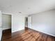 Bedroom with laminate wood floors, open closet and passage to another room at 4280 Summer Landing Dr # 204, Lakeland, FL 33810