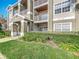 Inviting condo exterior featuring lush landscaping and multiple balconies and entry area at 4280 Summer Landing Dr # 204, Lakeland, FL 33810