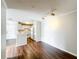 Open living room with laminate wood floors next to the kitchen at 4280 Summer Landing Dr # 204, Lakeland, FL 33810