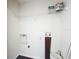 Utility room featuring washer/dryer hookups and overhead storage space, providing convenience and organization at 4280 Summer Landing Dr # 204, Lakeland, FL 33810