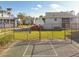 Outdoor basketball court area, with a hoop and a black chain-link fence surrounding the court at 4353 Shadow Crest Pl # 3, Orlando, FL 32811