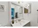Bathroom features a sleek vanity with white countertop and a decorative mirror at 4353 Shadow Crest Pl # 3, Orlando, FL 32811