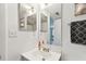 Bathroom with stylish sink, towel, and decorative mirror at 4353 Shadow Crest Pl # 3, Orlando, FL 32811