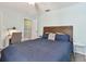 Comfortable bedroom featuring a workspace, neutral paint and wood-look floors at 4353 Shadow Crest Pl # 3, Orlando, FL 32811