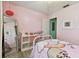 Pink bedroom featuring a full-length mirror, white storage cube and fun decor at 4353 Shadow Crest Pl # 3, Orlando, FL 32811