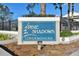 Sign for Spine Shadows Condominiums with landscaping in front of the sign at 4353 Shadow Crest Pl # 3, Orlando, FL 32811