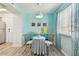Cozy dining area featuring a round table, seating for two, and natural light from the window at 4353 Shadow Crest Pl # 3, Orlando, FL 32811