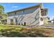 Exterior of condo showing the side of the building with siding and landscaping at 4353 Shadow Crest Pl # 3, Orlando, FL 32811
