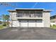 View of condominium with garages and screened patios on the second floor at 4353 Shadow Crest Pl # 3, Orlando, FL 32811