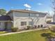 View of two-story condo unit showing landscape, and exterior siding at 4353 Shadow Crest Pl # 3, Orlando, FL 32811