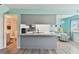 Bright kitchen showcasing marble countertops, a stainless steel sink, and bar seating at 4353 Shadow Crest Pl # 3, Orlando, FL 32811