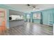 Open living area featuring vinyl floors, a breakfast bar and natural lighting at 4353 Shadow Crest Pl # 3, Orlando, FL 32811