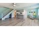 Open-concept living room with modern flooring and staircase to the upper level at 4353 Shadow Crest Pl # 3, Orlando, FL 32811