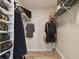 Walk-in closet with wire shelving for shoes, folded garments and hanging clothes at 4353 Shadow Crest Pl # 3, Orlando, FL 32811