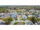 Neighborhood aerial view showcasing the community layout, streets, and nearby amenities at 458 Hollinghead Loop, Davenport, FL 33896