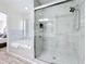 Bathroom featuring a tiled shower, soaking tub, and soft decor at 458 Hollinghead Loop, Davenport, FL 33896