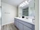 Double sink bathroom vanity with a shower and tub at 458 Hollinghead Loop, Davenport, FL 33896